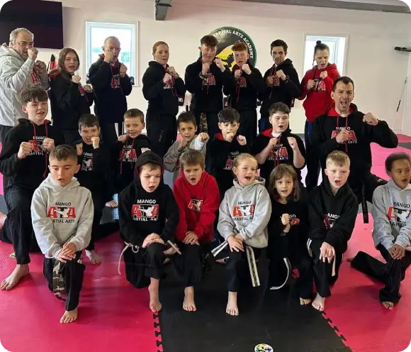 Parents watching children perform martial arts skills